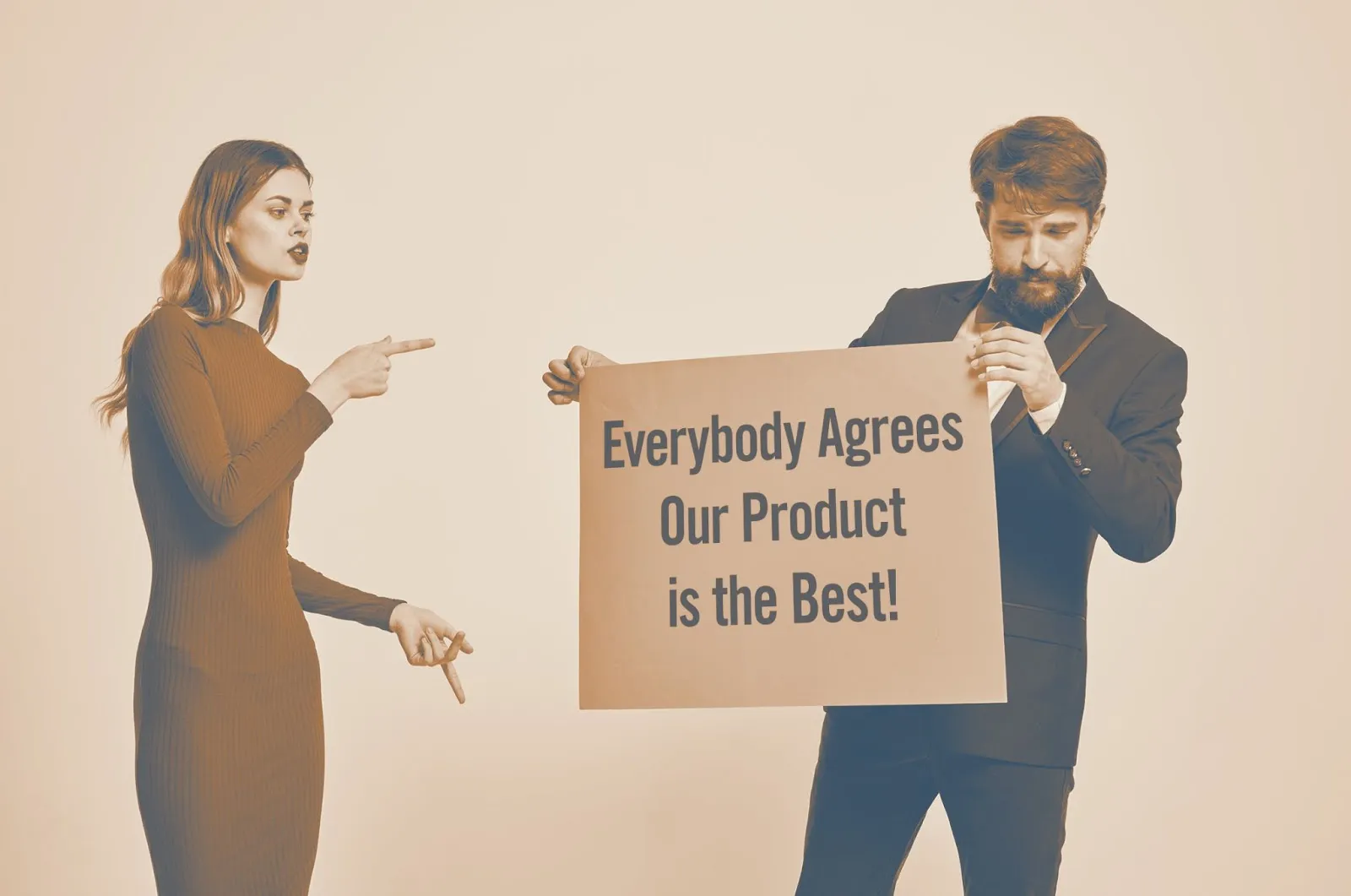 Woman pointing at man holding a sign reading Everybody Agrees Our Product is the Best